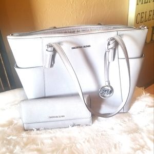 Gray Michael Kors purse and wallet